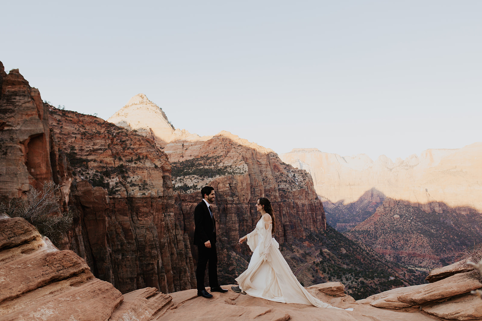 couple elopes on overlook at Zion National Park wedding 