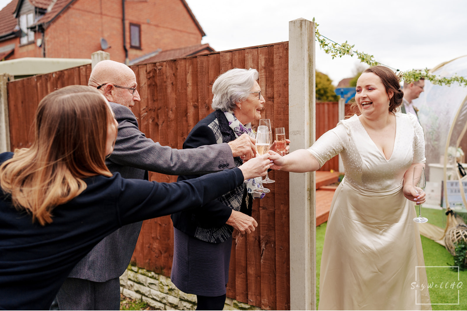 Newark Registry Office Wedding Photography - bride and groom toasting some wedding friends