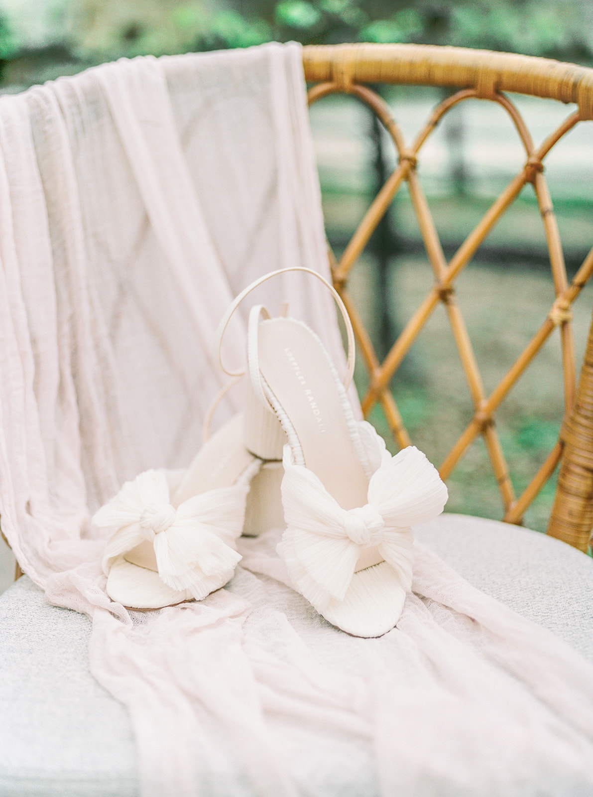 Bridal heels on a vintage chair, Sunstone Winery wedding, captured by Southern California's Tiffany Longeway.