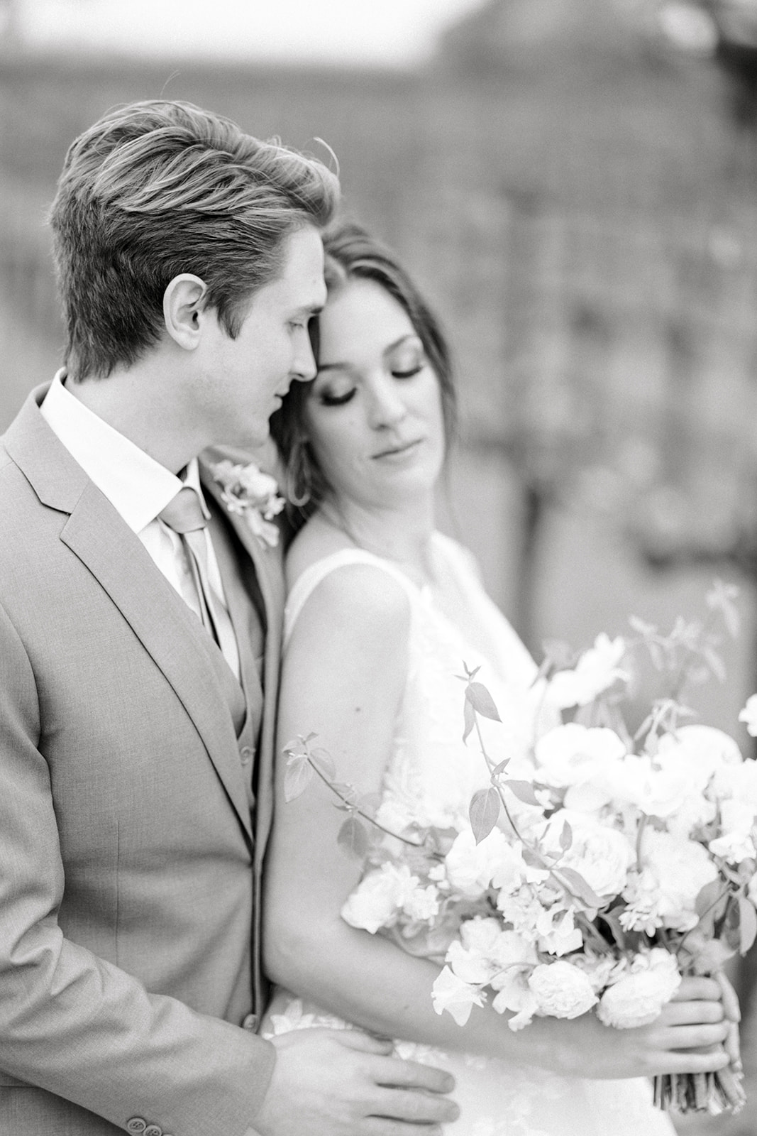 Intimate moment between newlyweds at Sunstone Winery, photographed by Tiffany Longeway, Southern California's luxury wed