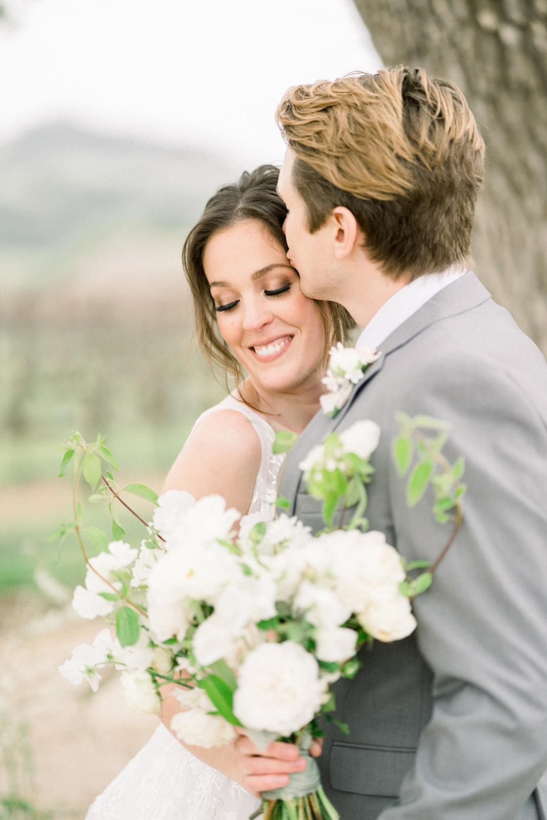 Intimate moment between newlyweds at Sunstone Winery, Southern California's luxury wedding