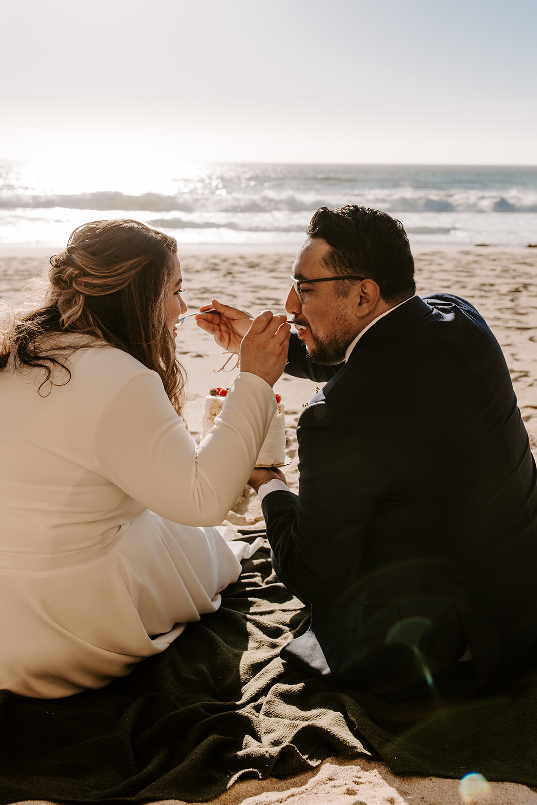 Couple who eloped in Big Sur have cake cutting on the beach