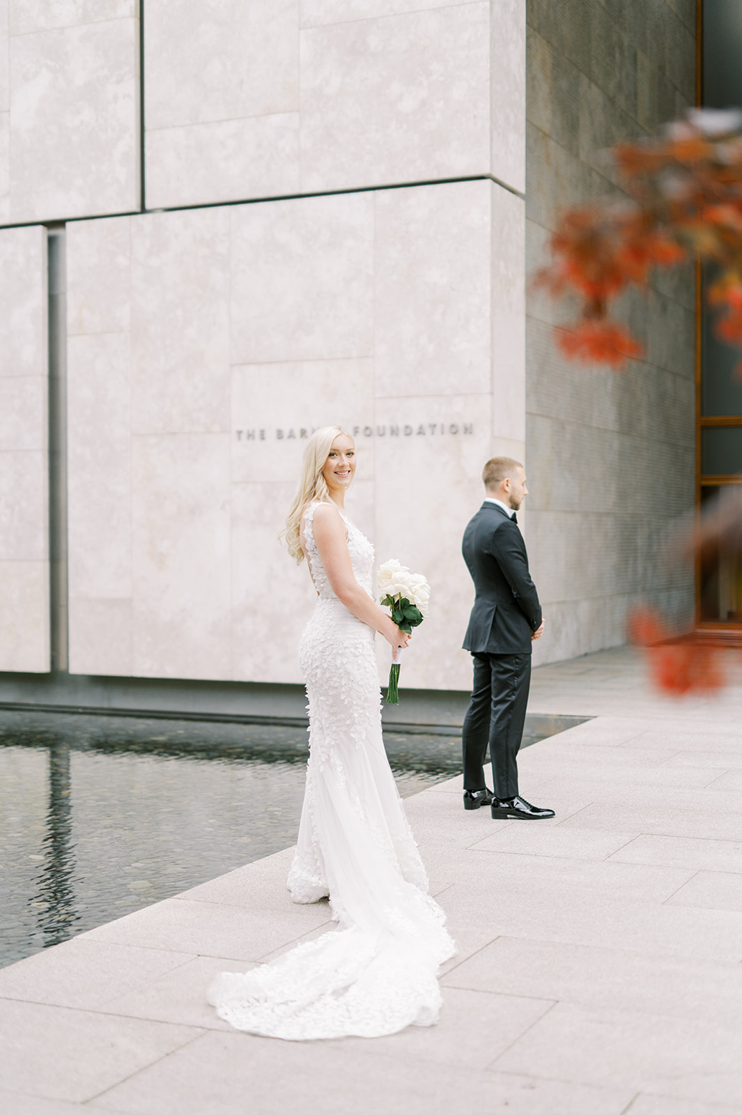 Bride approaching groom before the first look at the Barnes Foundation reflecting pool