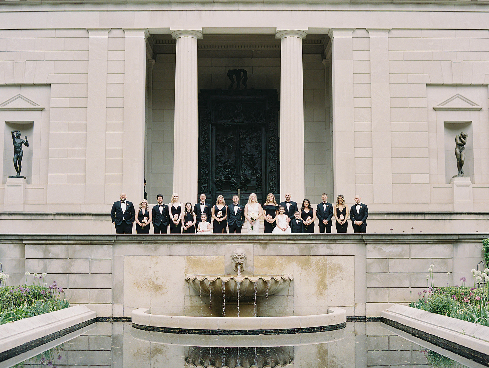 wedding party attendants against the reflecting pool of Rodin Museum