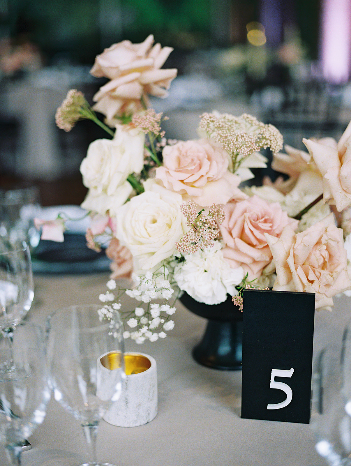 blush and white centerpiece with black compote and black table numbers