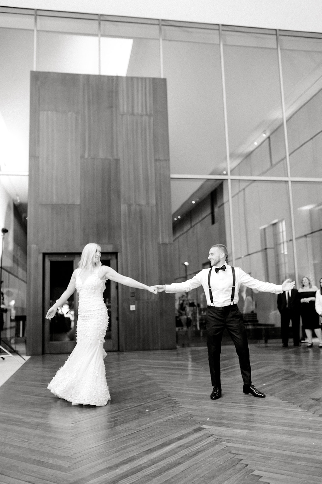 black and white photo of bride and groom dancing at their wedding reception at the Barnes Foundation