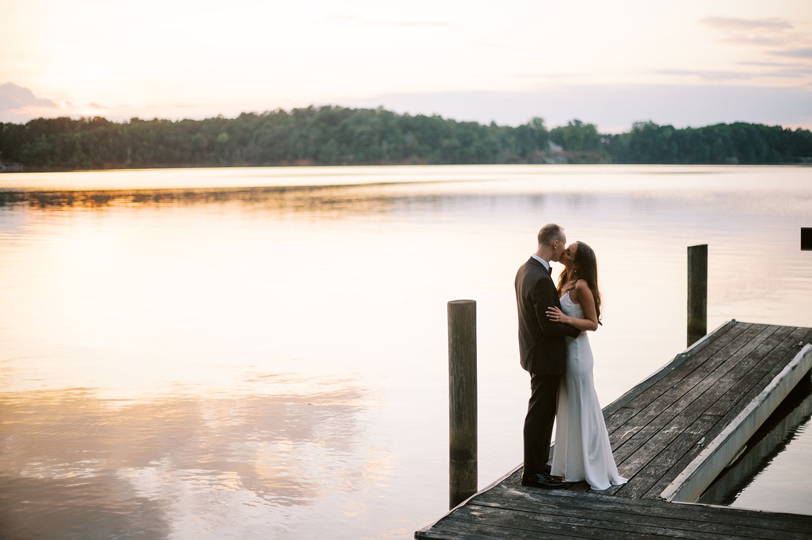 bride and groom at lake dock at Catawba Falls Wedding in South Carolina