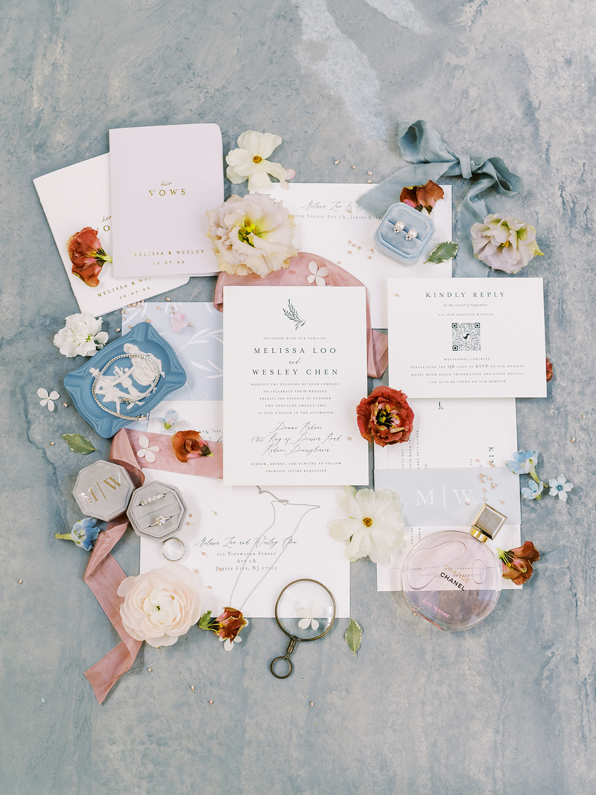 blue and burgundy invitation suite with floral details