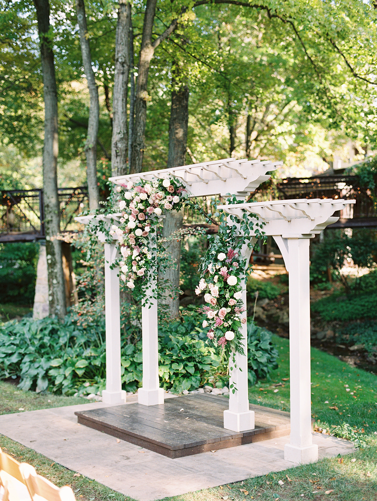ceremony arch with lush parisian inspired florals at Pomme in Radnor, PA