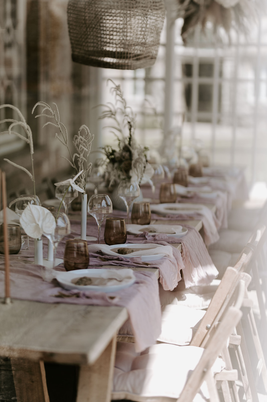 wedding reception table set up with neutral colour scheme and dried florals