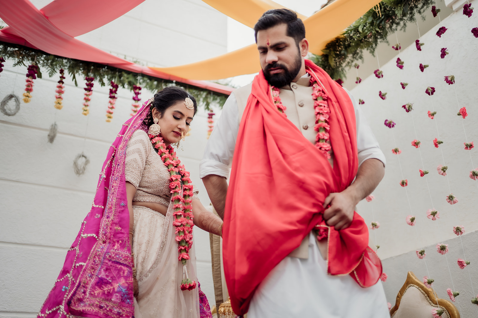 Pious commitment: The bride and groom partake in the pheras ceremony, expressing their devotion and love for each other