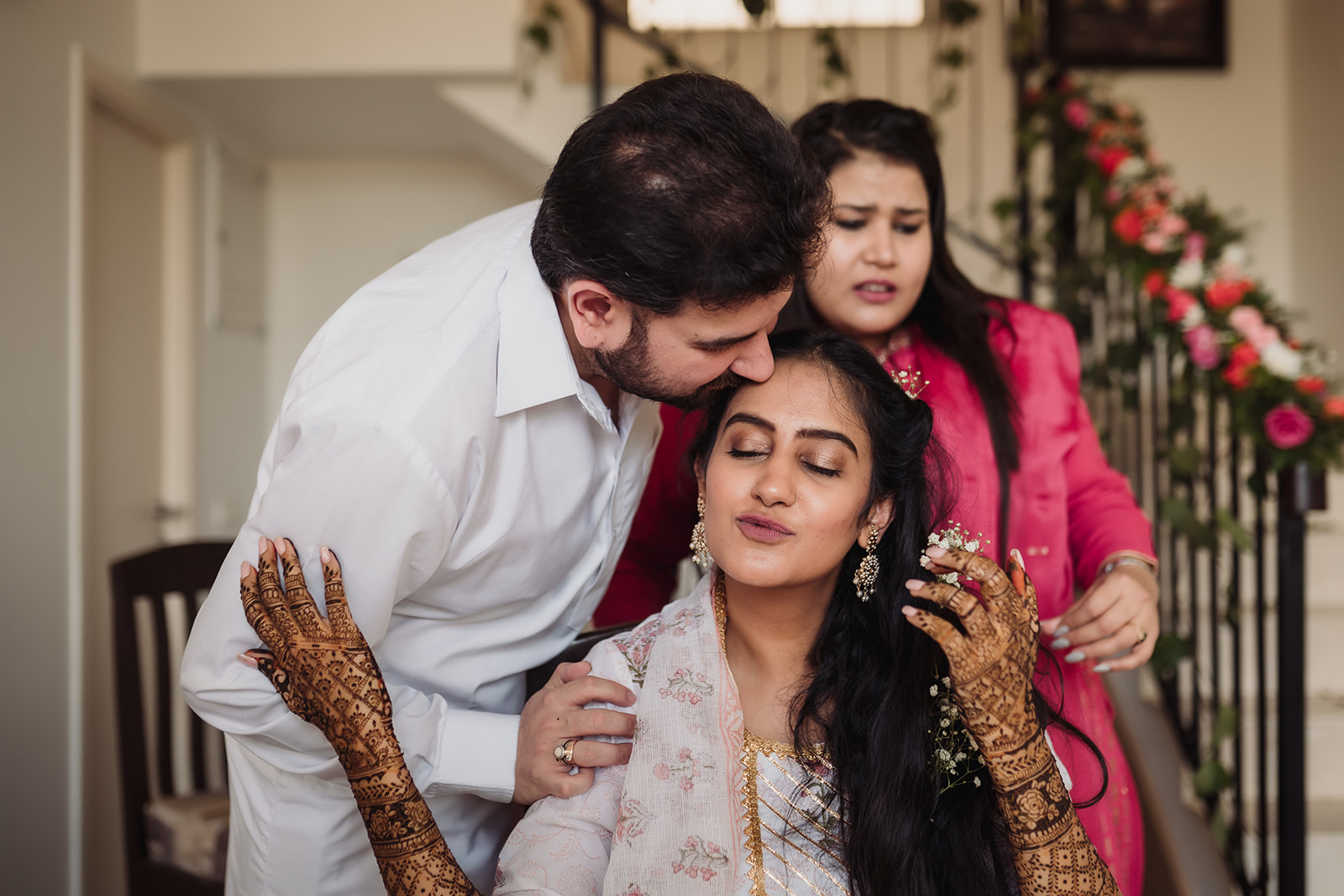 Family love in a frame: The bride shares a special selfie moment, surrounded by the warmth of her family