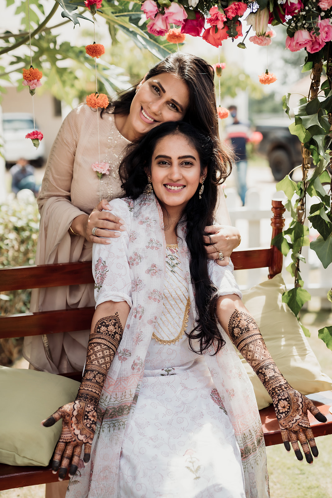 Mehendi elegance: The bride showcases intricate mehendi designs on her hands in a beautiful image.
