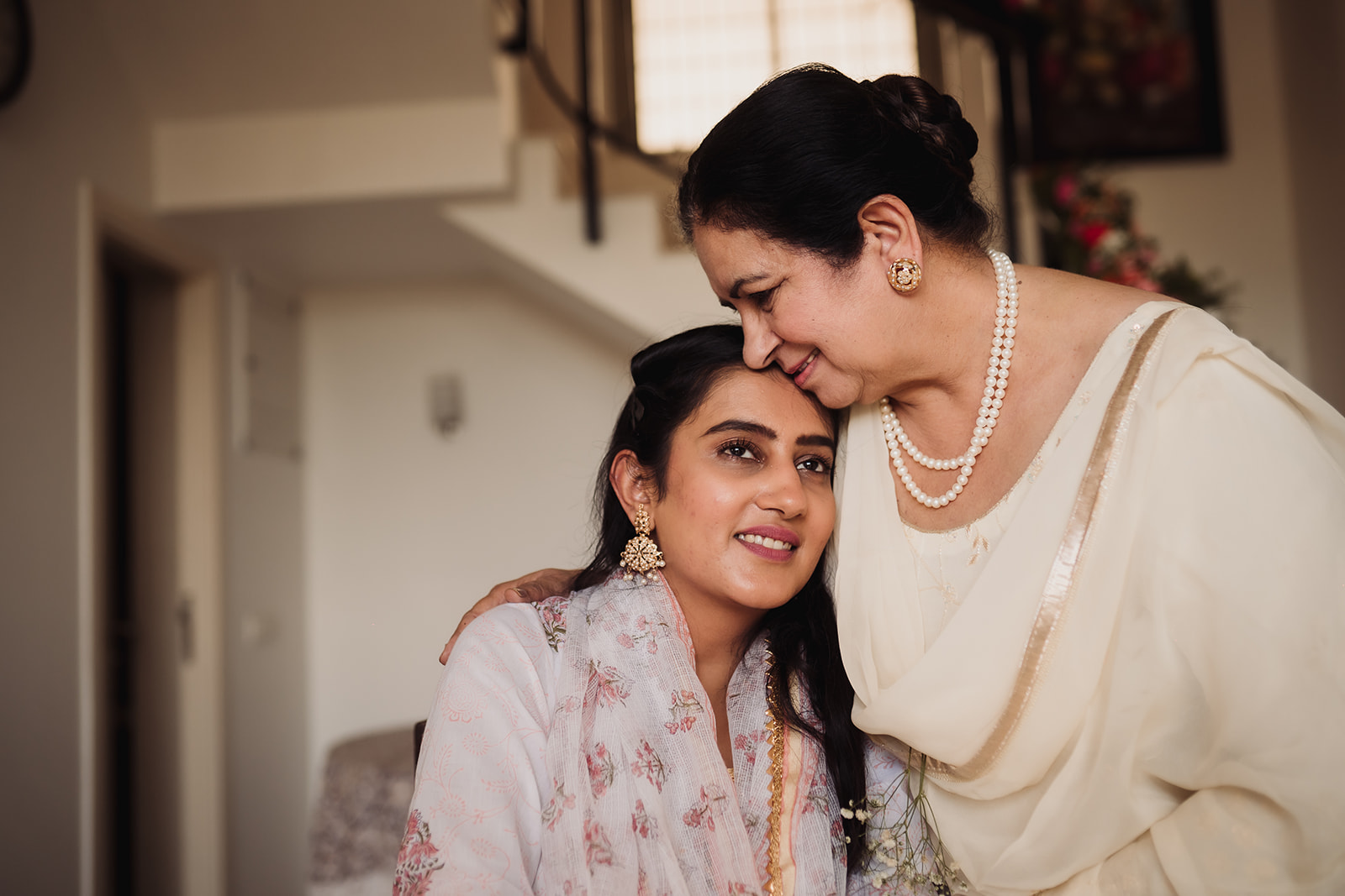 Bridal family portrait: The bride and her mom come together in a loving and memorable photograph