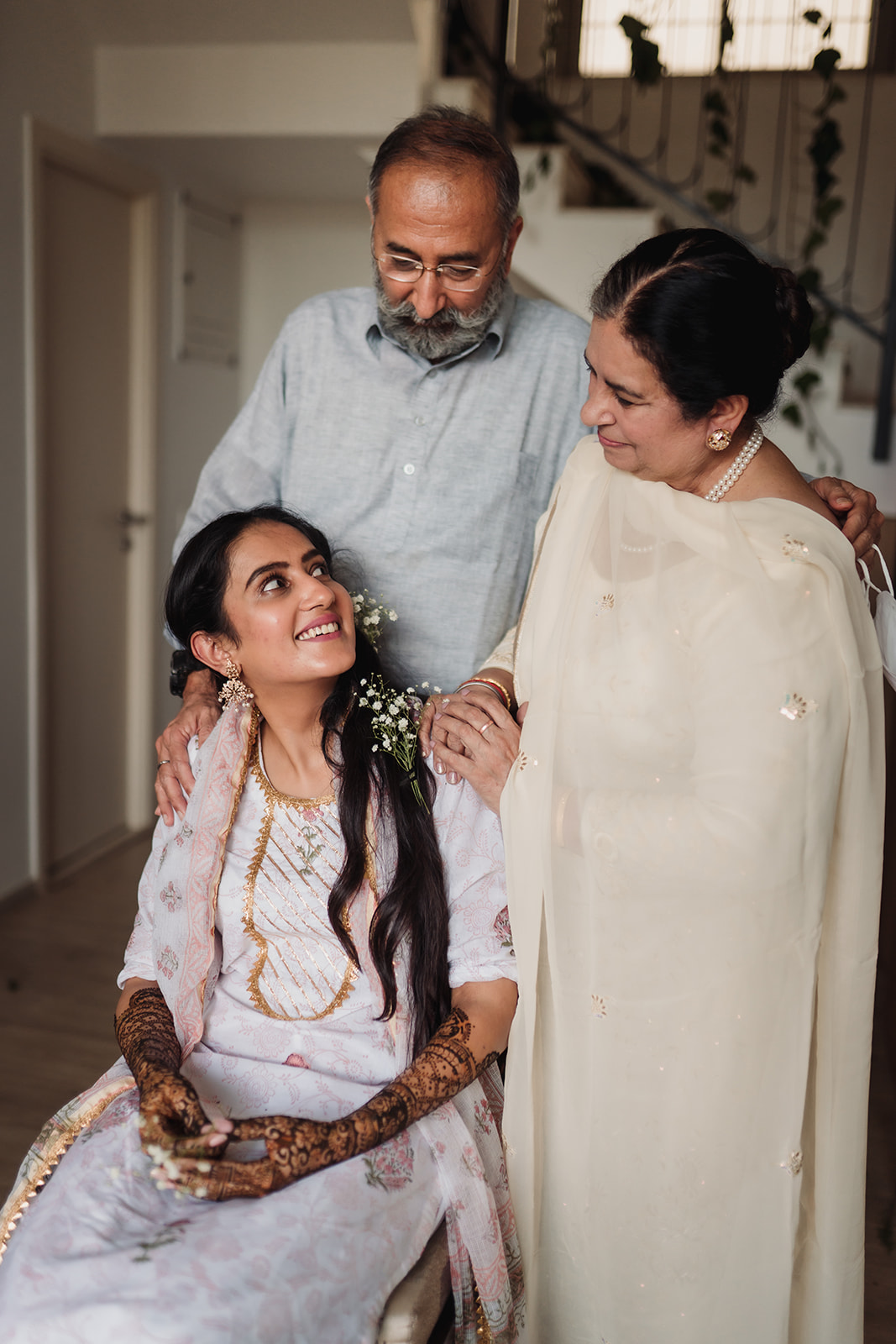 Bridal bond: A beautiful image of the bride surrounded by the love and support of her parents