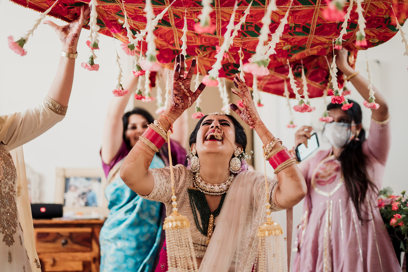 Aisle elegance: The bride makes her entrance, adorned by a lovely chadar, creating a scene of timeless beauty