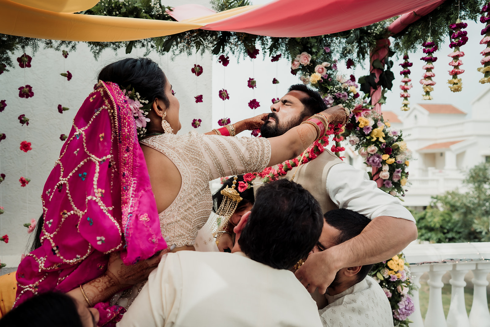 Garland exchange: A joyful moment as the bride and groom lovingly exchange floral garlands during the ceremony.