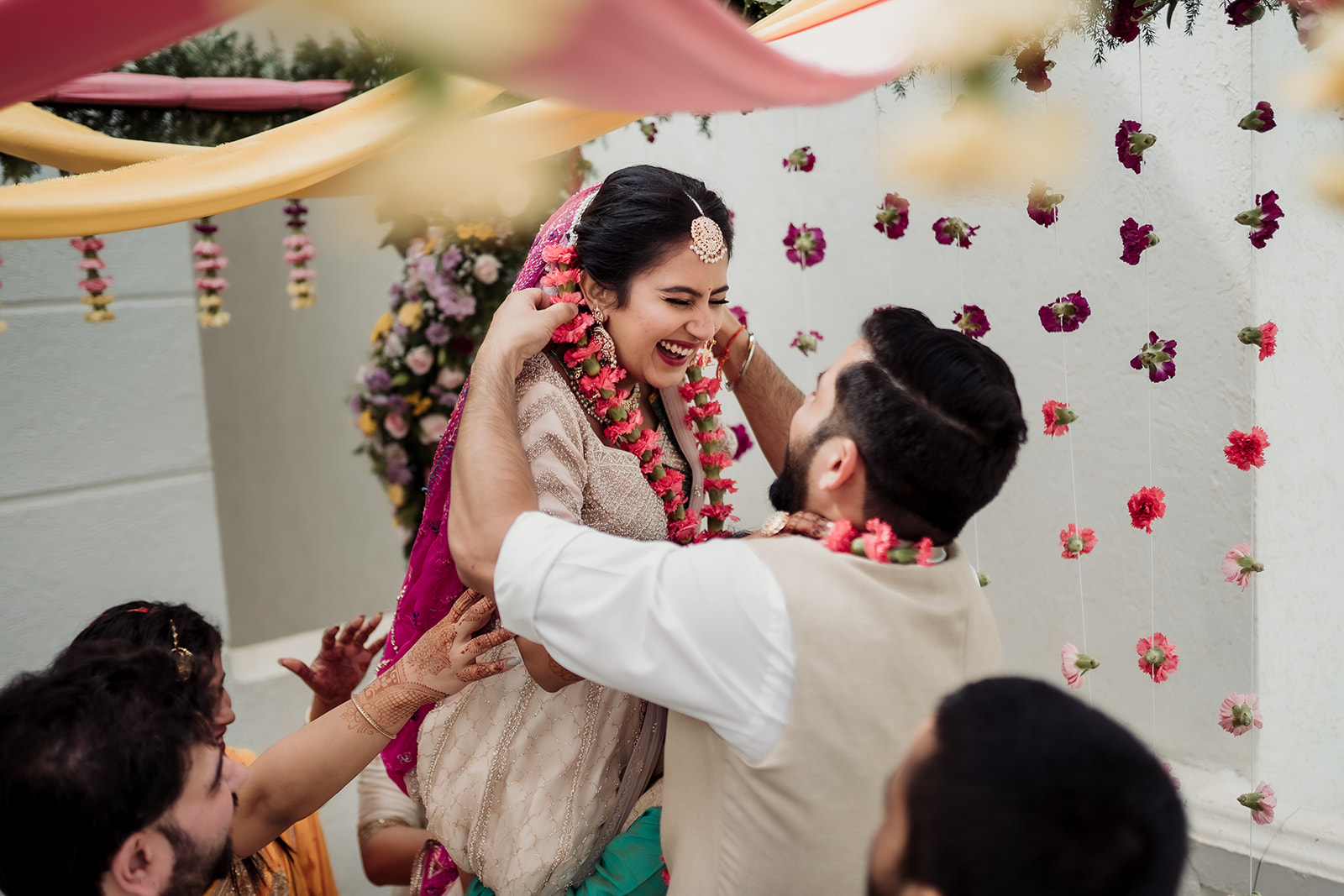 Garland exchange: A joyful moment as the bride and groom lovingly exchange floral garlands during the ceremony.