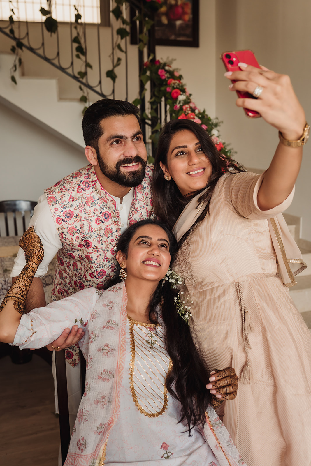 Family selfie joy: The bride captures a joyful moment with her loved ones in this heartwarming image