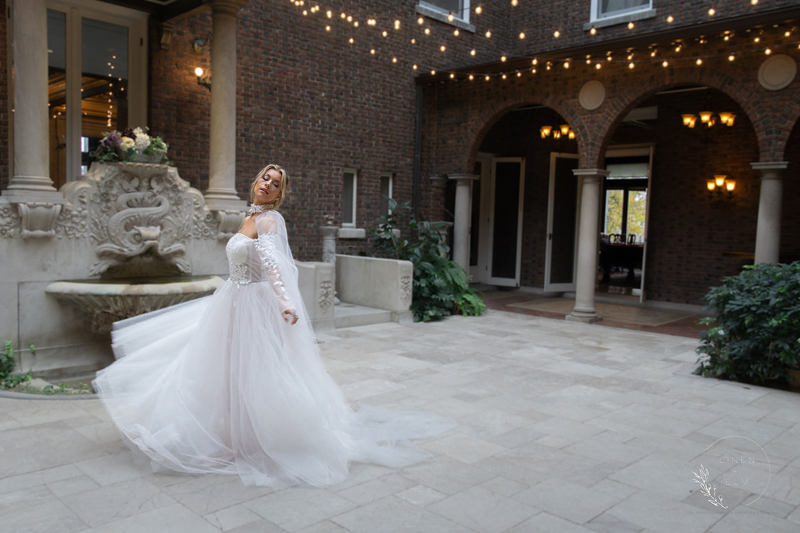 bridal portrait twirling in courtyard at Laurel Court Cincinnati Ohio