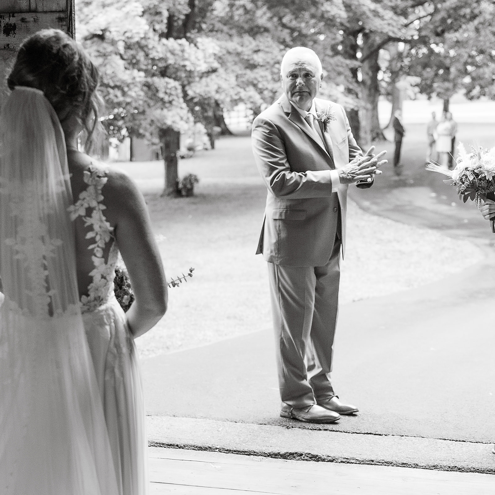 Dad first look of bride reaction shot black and white