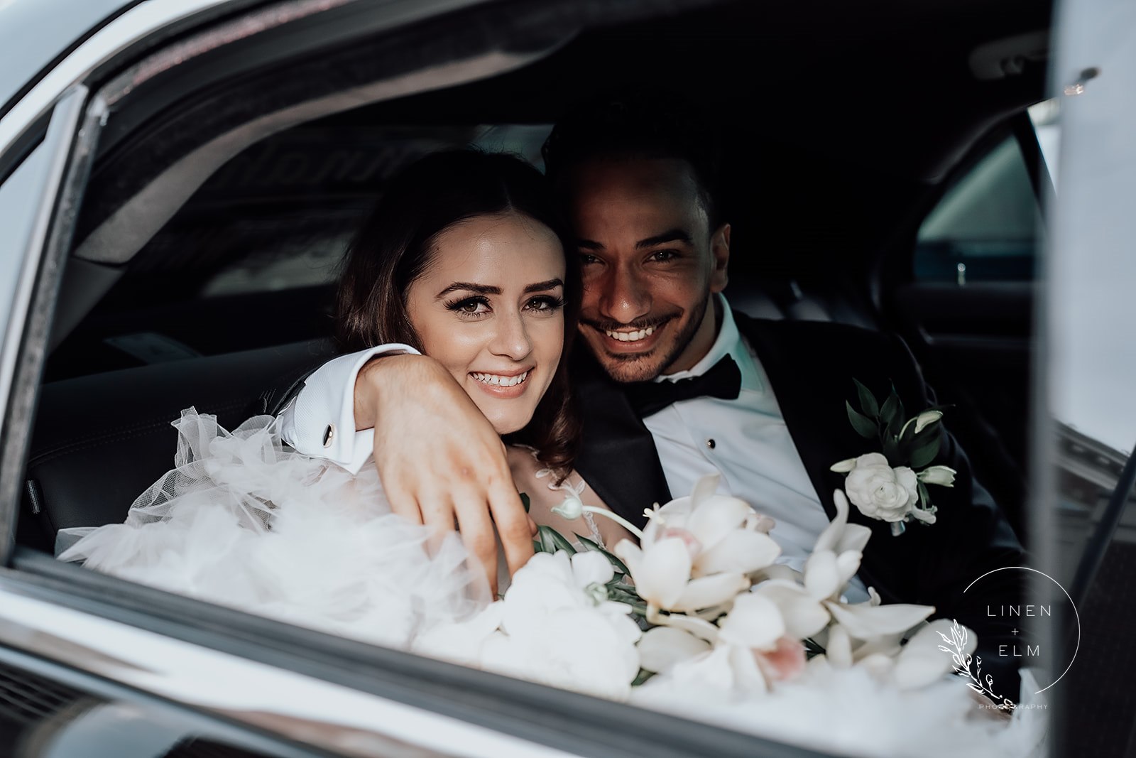 newly married couple in limo at Lytle Park Hotel, Cincinnati Ohio