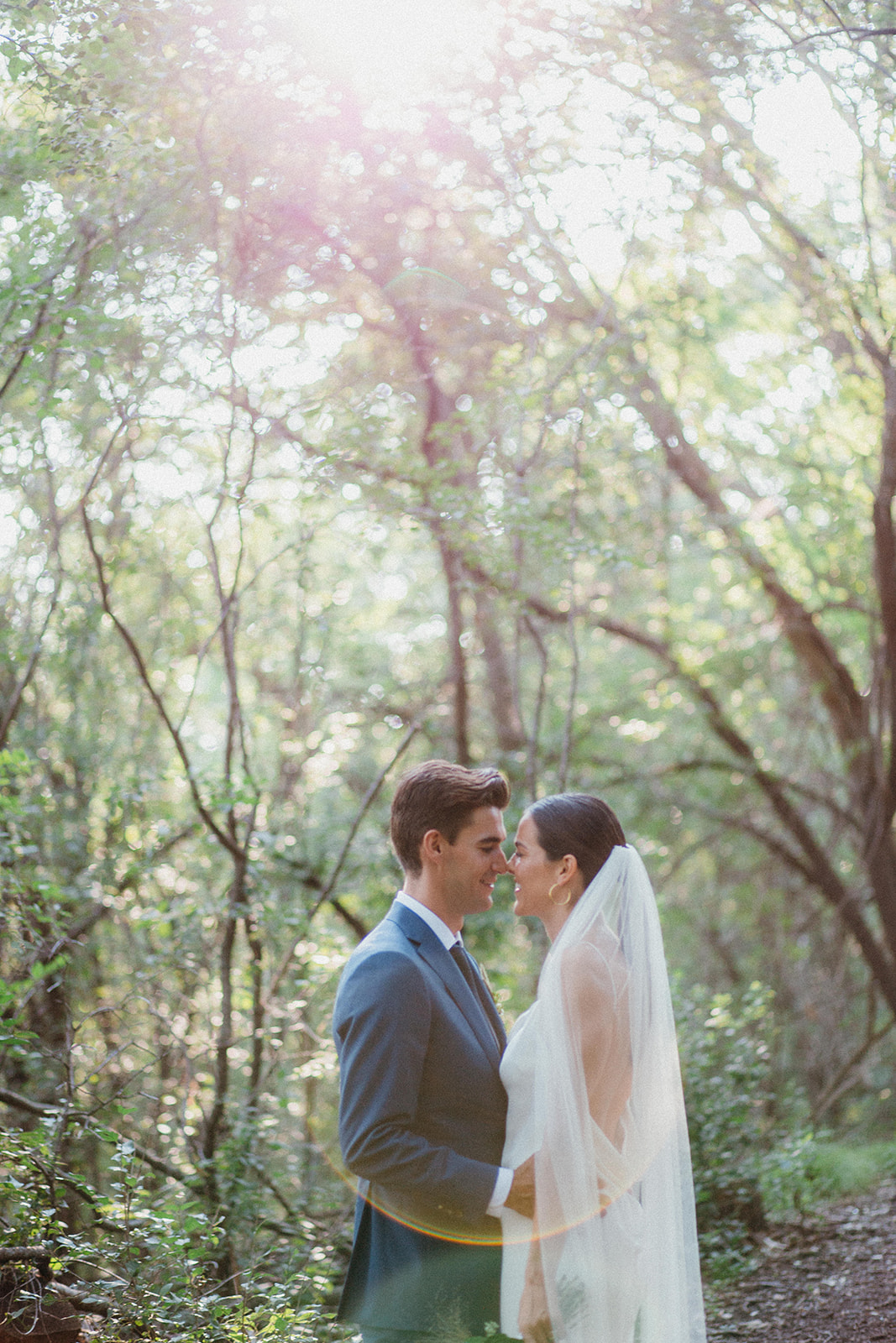 Bride and groom portrait in a dreamy forest light at Camp Wandawega