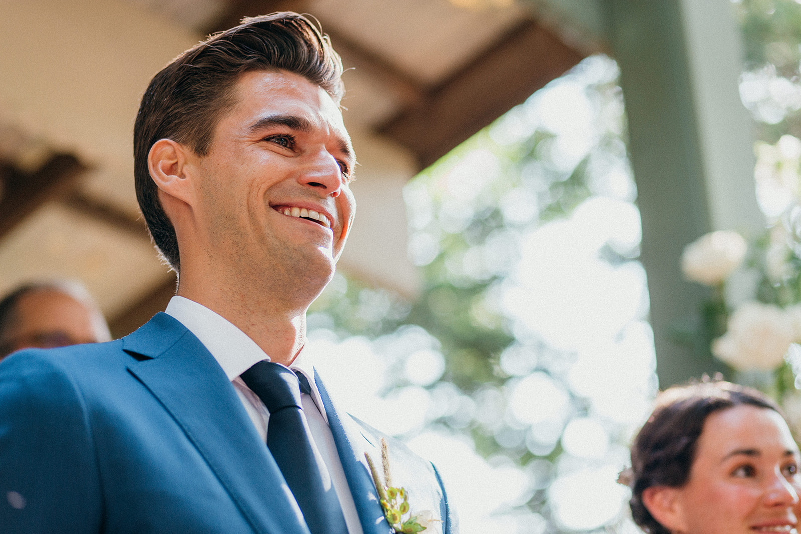 Groom is overwhelmed with joy when he sees his bride walk down the aisle at Camp Wandawega