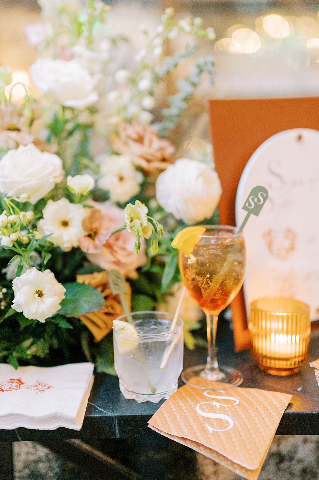 bright modern summer cocktail in orange with cream florals for Summer Crossed Keys Estate Wedding by Haley Richter Photo
