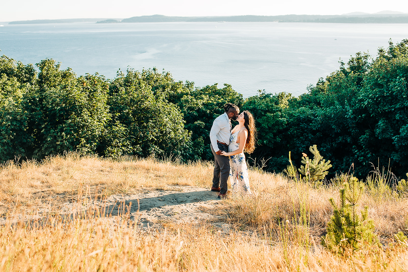 An interracial couple is photographed for their engagement session at Discovery Park in Seatttle, WA
