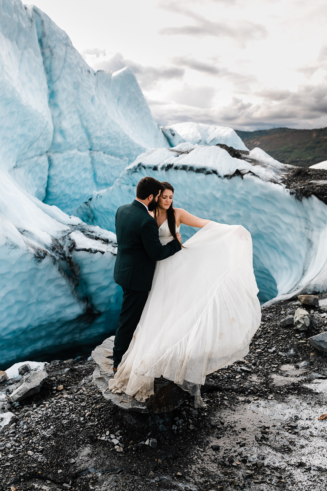 wedding couple hiking on a glacier