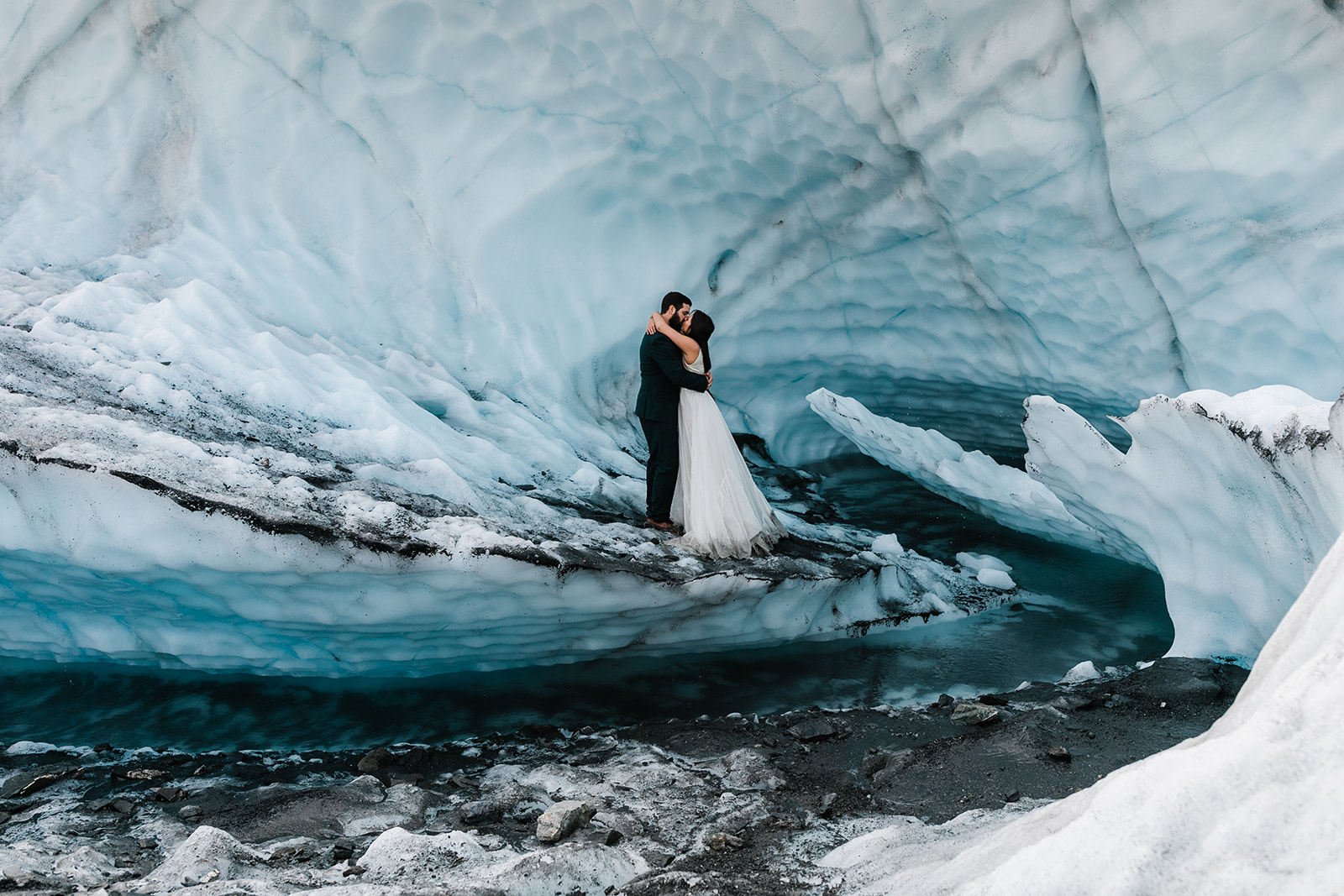 wedding couple hiking on a glacier