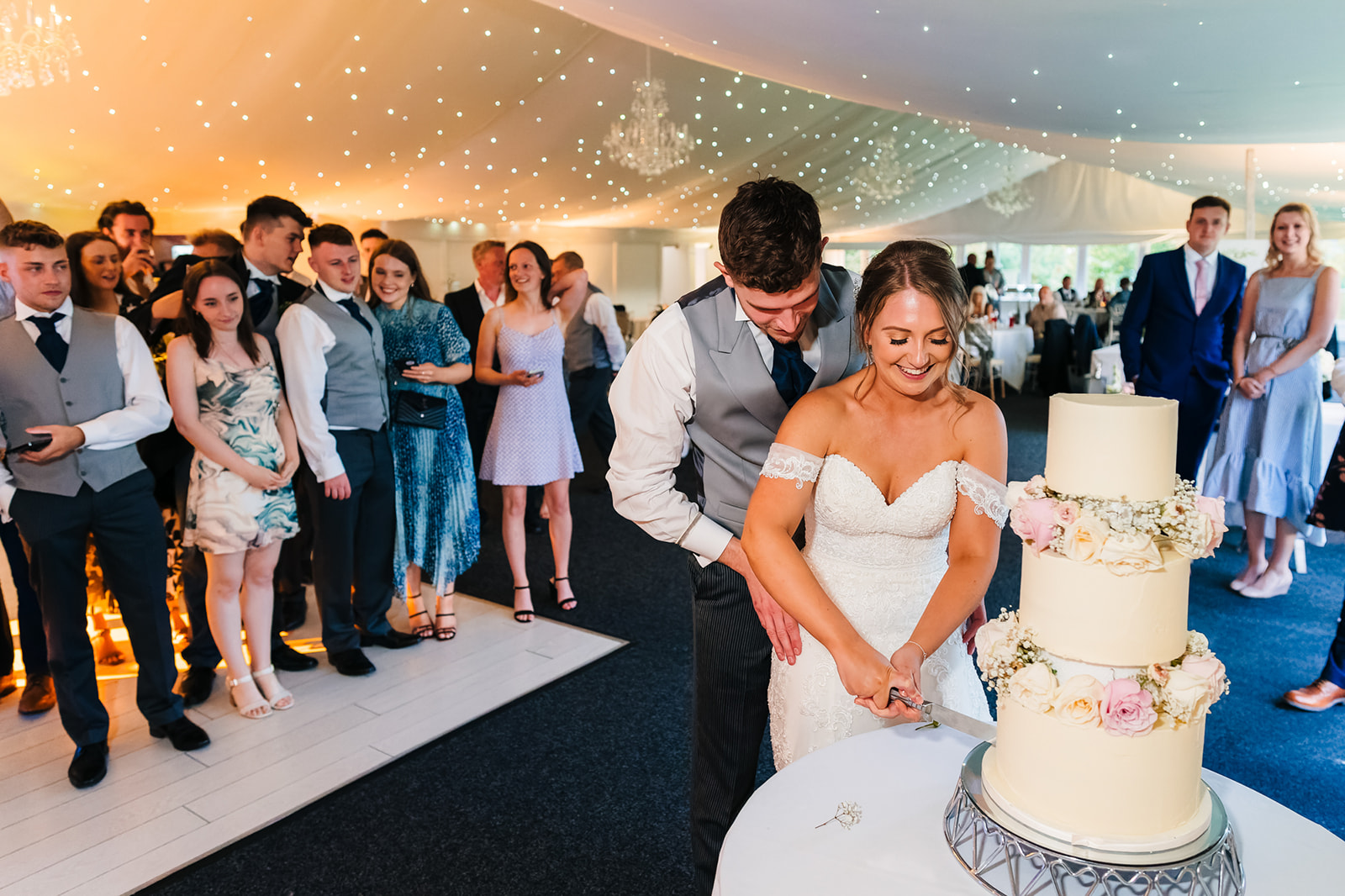 Shottle Hall Wedding Photography - bride and groom cutting the wedding cake