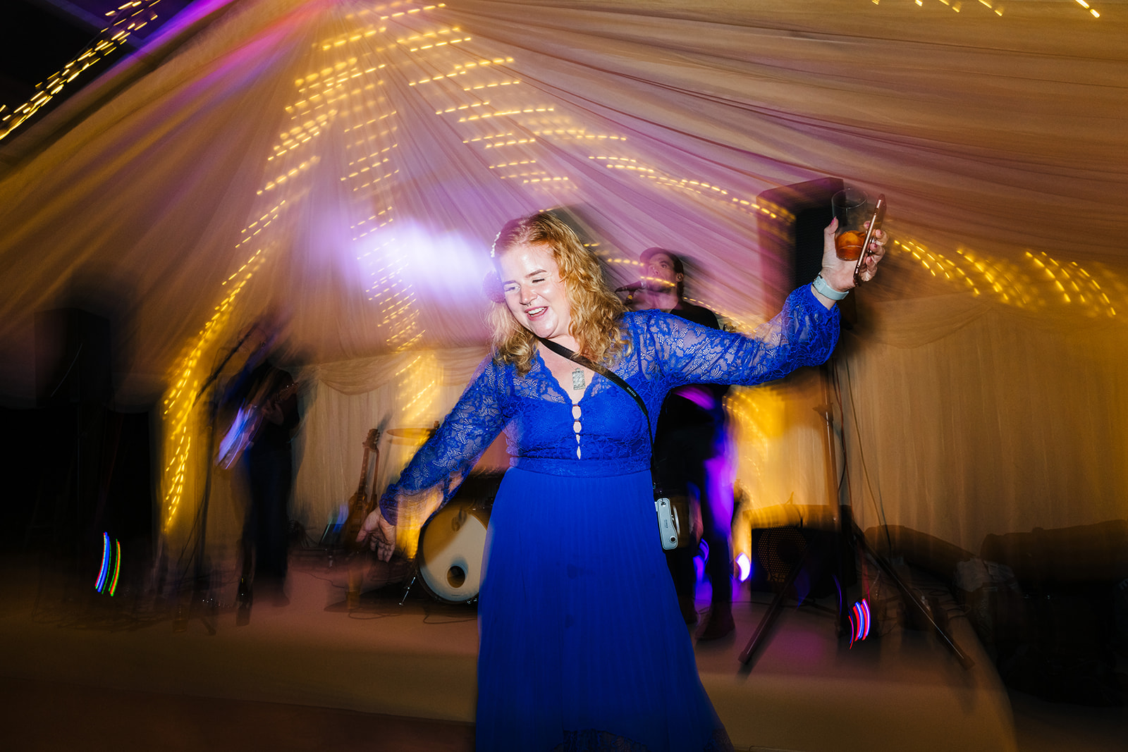 Wedding guests dance to the music from the live band
