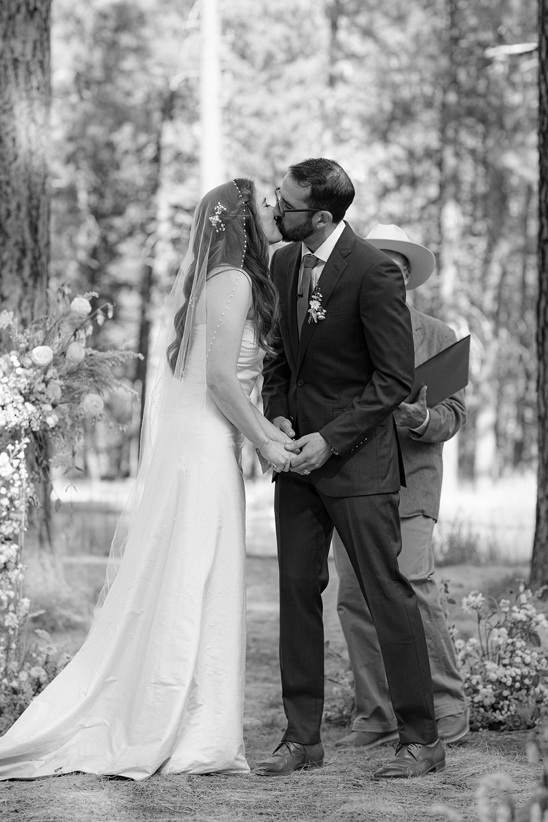 bride and groom first kiss after ceremony central oregon