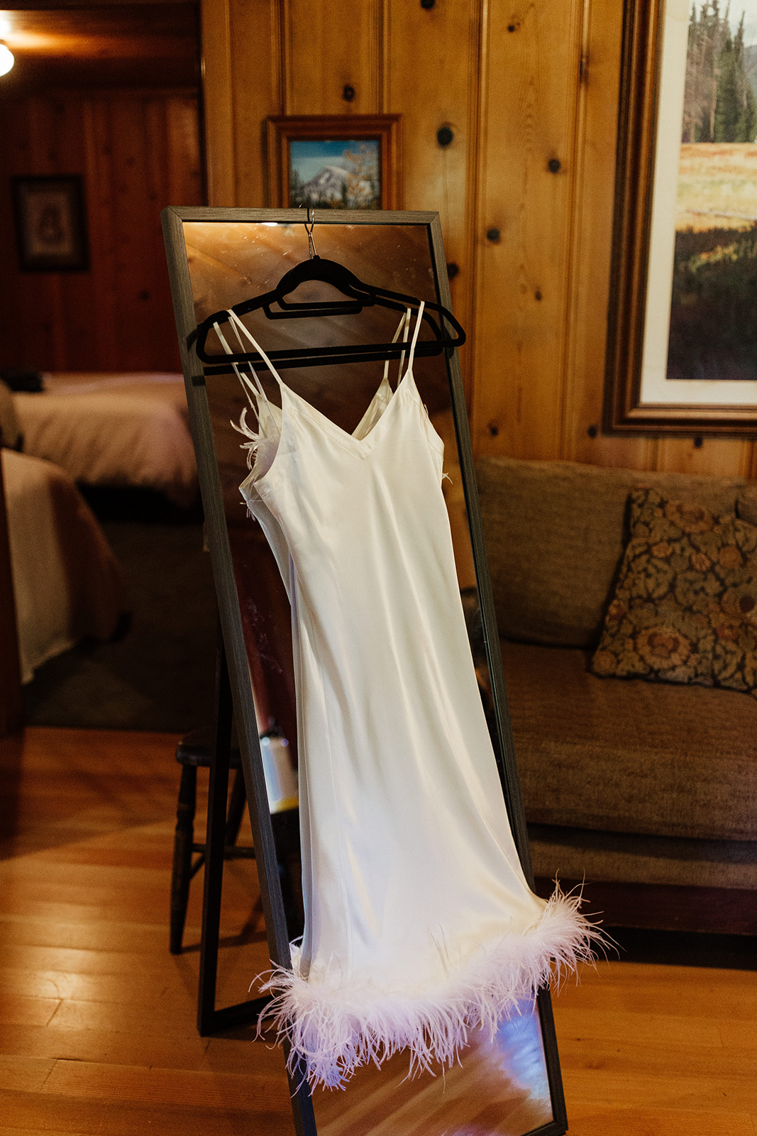 bride thrifted reception dress with feathers