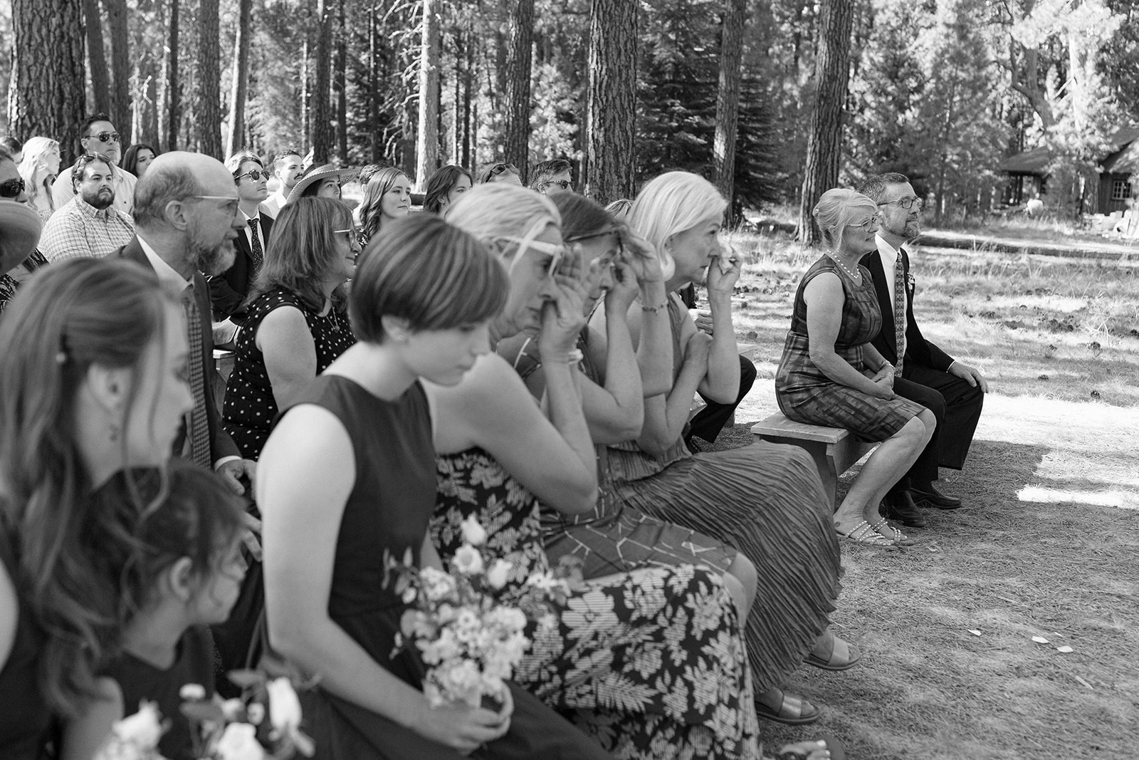 ceremony guests wiping tears at lake creek lodge