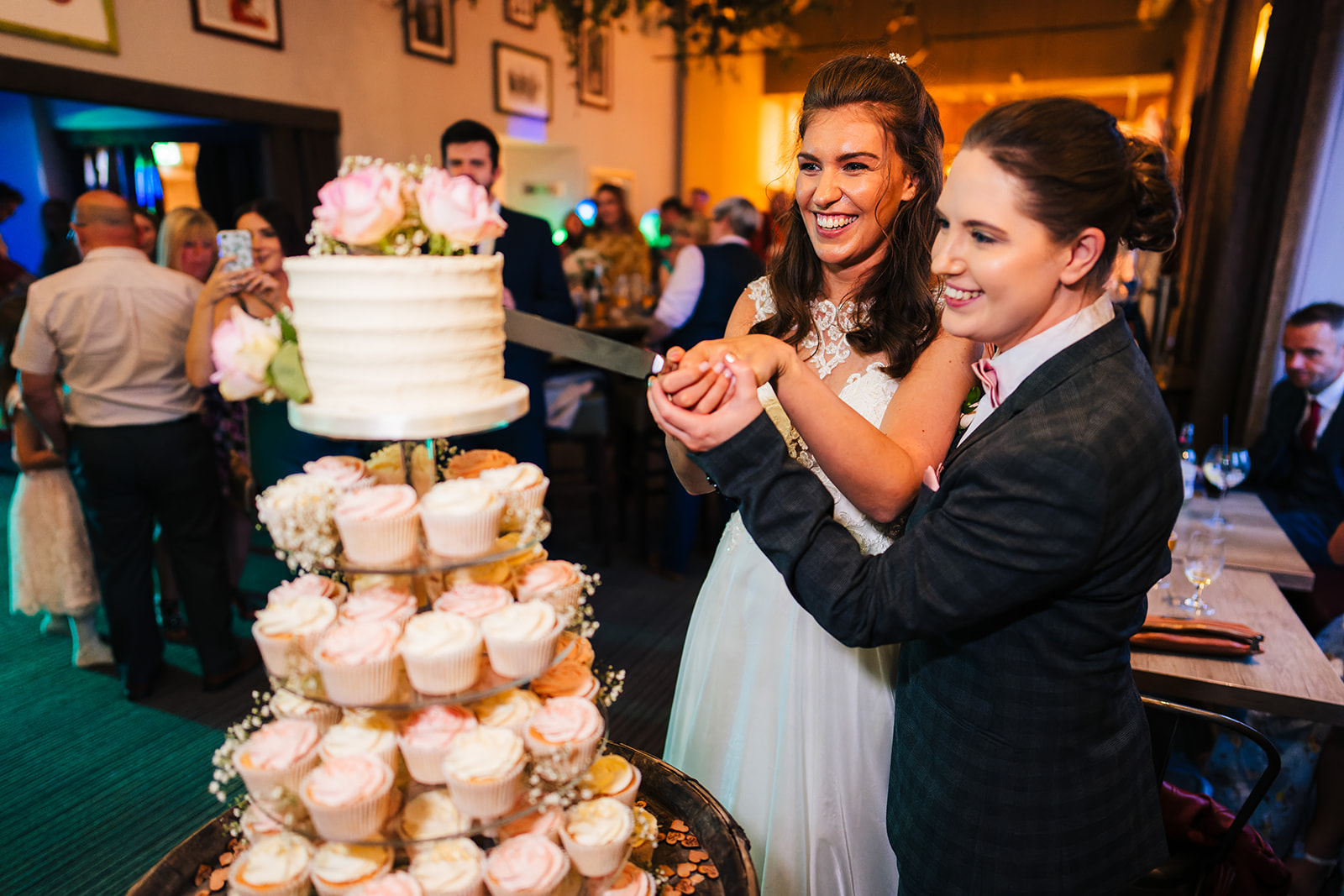 The Brewhouse & Kitchen Wedding Photography - the two bride is cutting the wedding