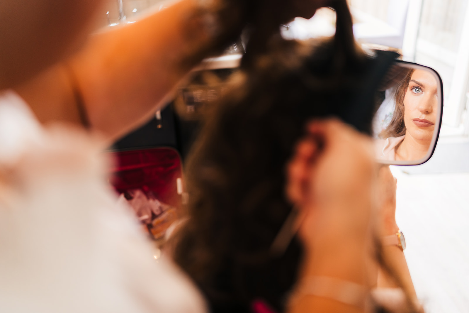 The Brewhouse & Kitchen Wedding Photography - a reflection of the bride in a mirror, having her hair done