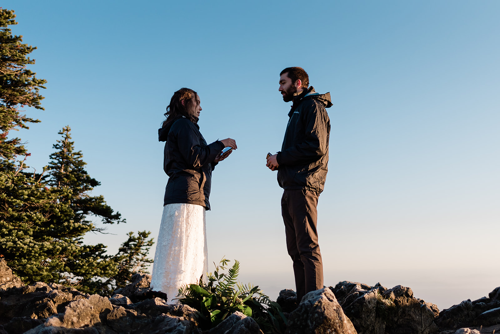 This is a picture of a bride and groom sharing their vows during their olympic national park elopement.
