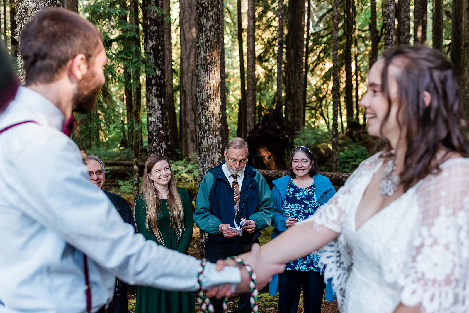 This is a picture taken during an elopement ceremony. It is the bride and groom and their loved ones.