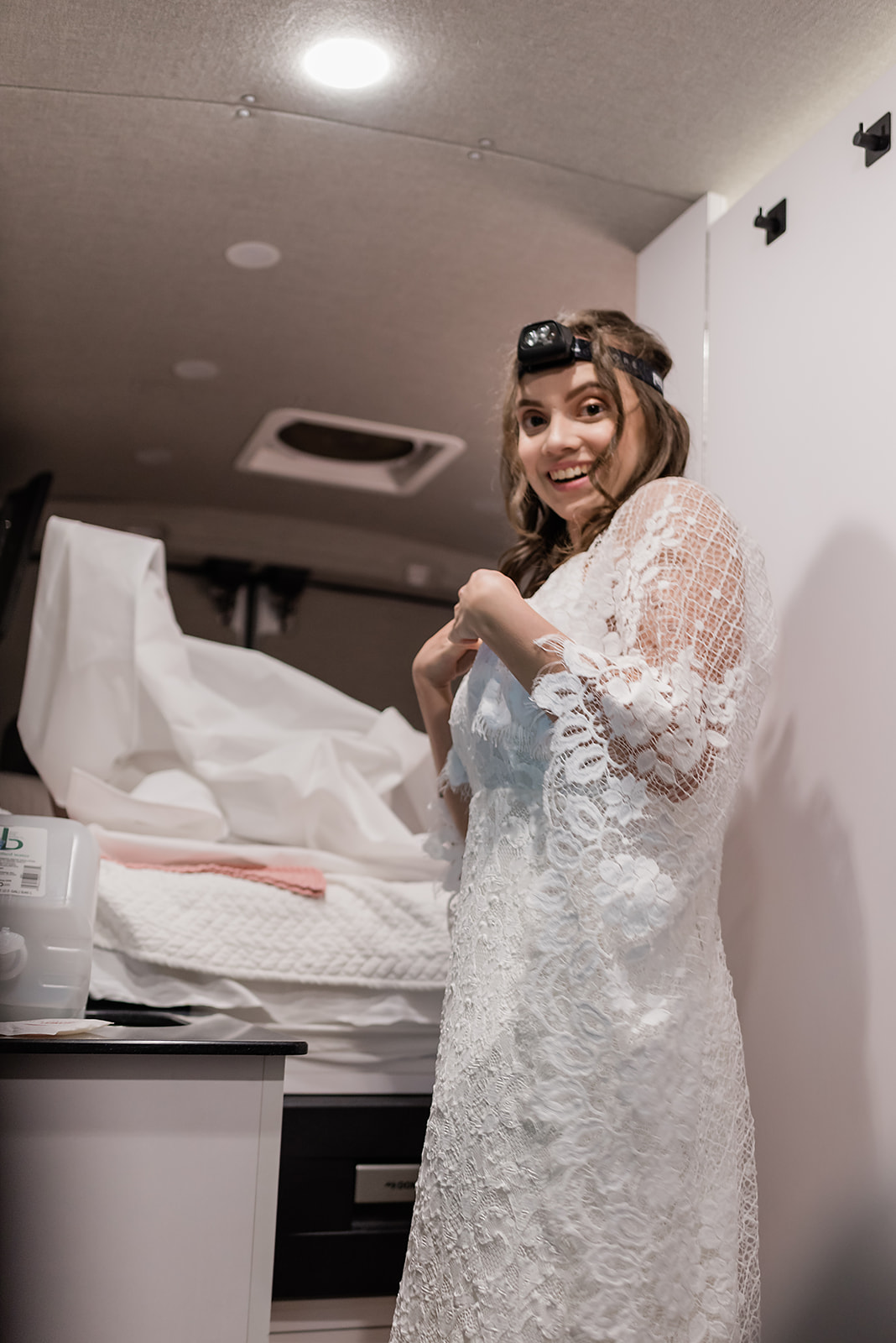 This is a picture of a bride getting ready in a sprinter van.