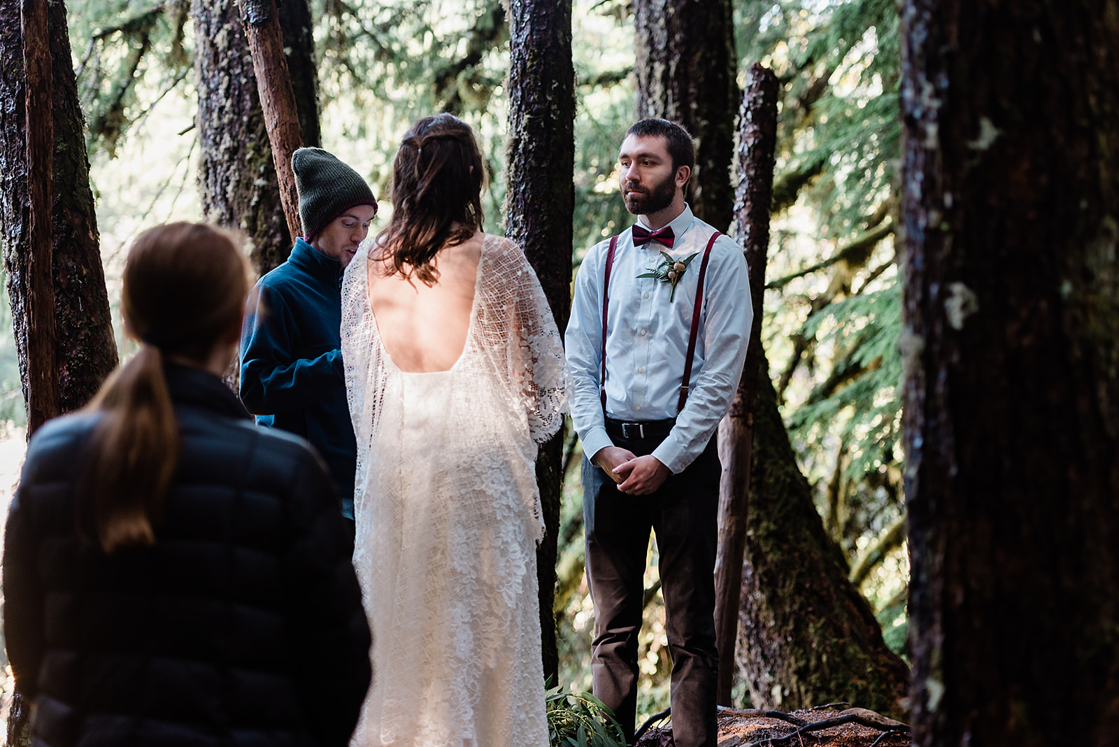 This is a picture taken during an elopement ceremony. It is the bride and groom and their loved ones.