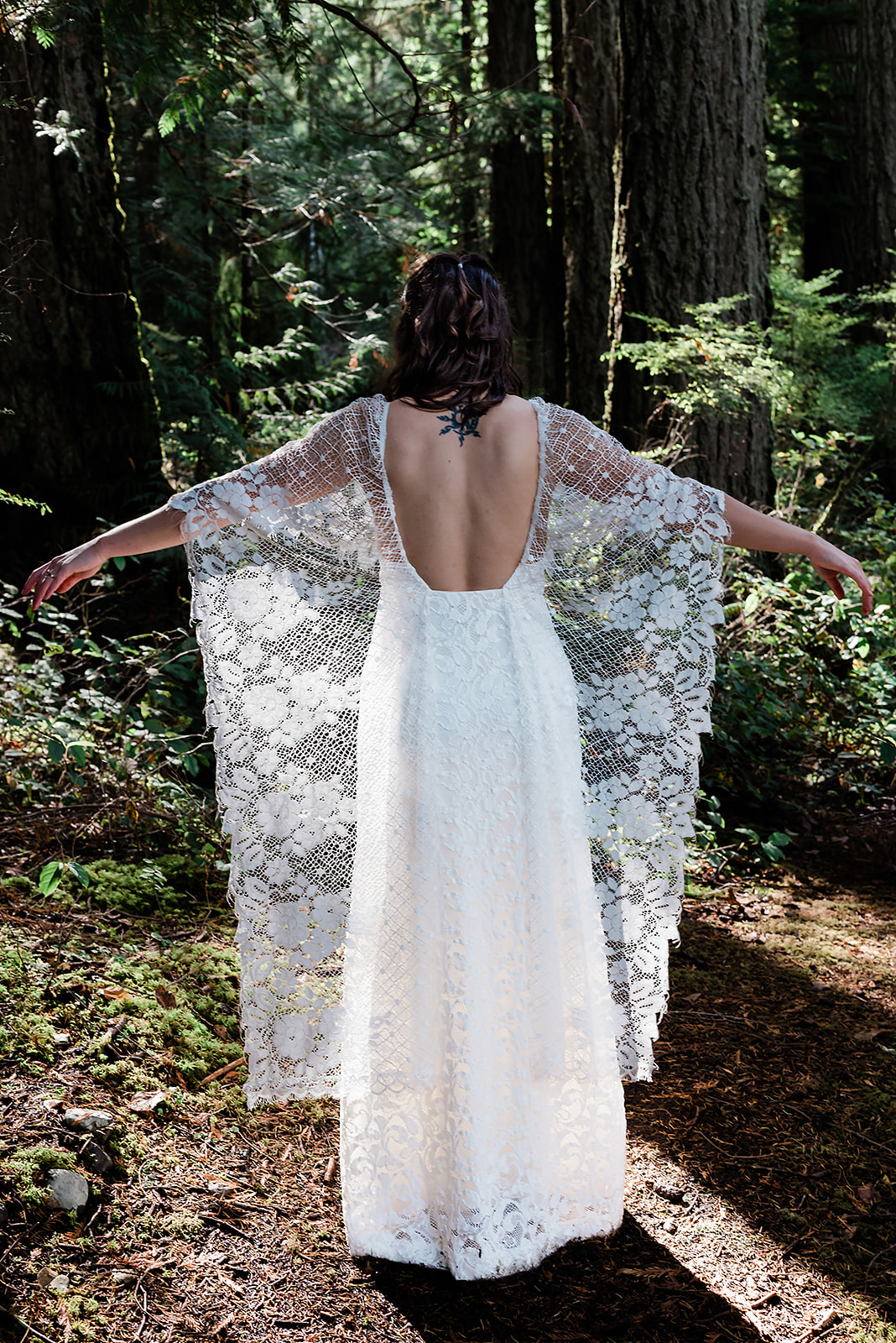 This is a picture of the bride in a forest.