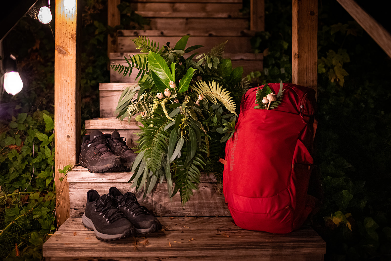 This is a picture of florals from an Olympic national park elopement with a backpack and a pair of shoes.