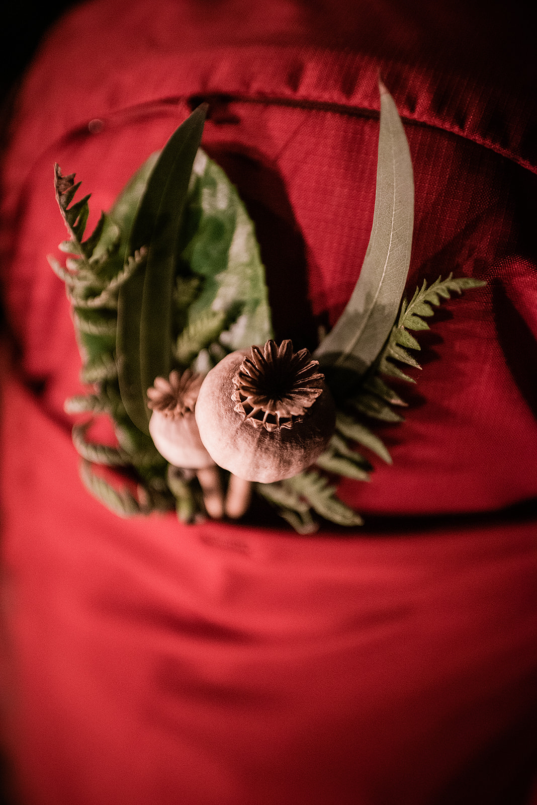 This is a picture from an Olympic National Park elopement. It is a close up of a backpack and florals. 