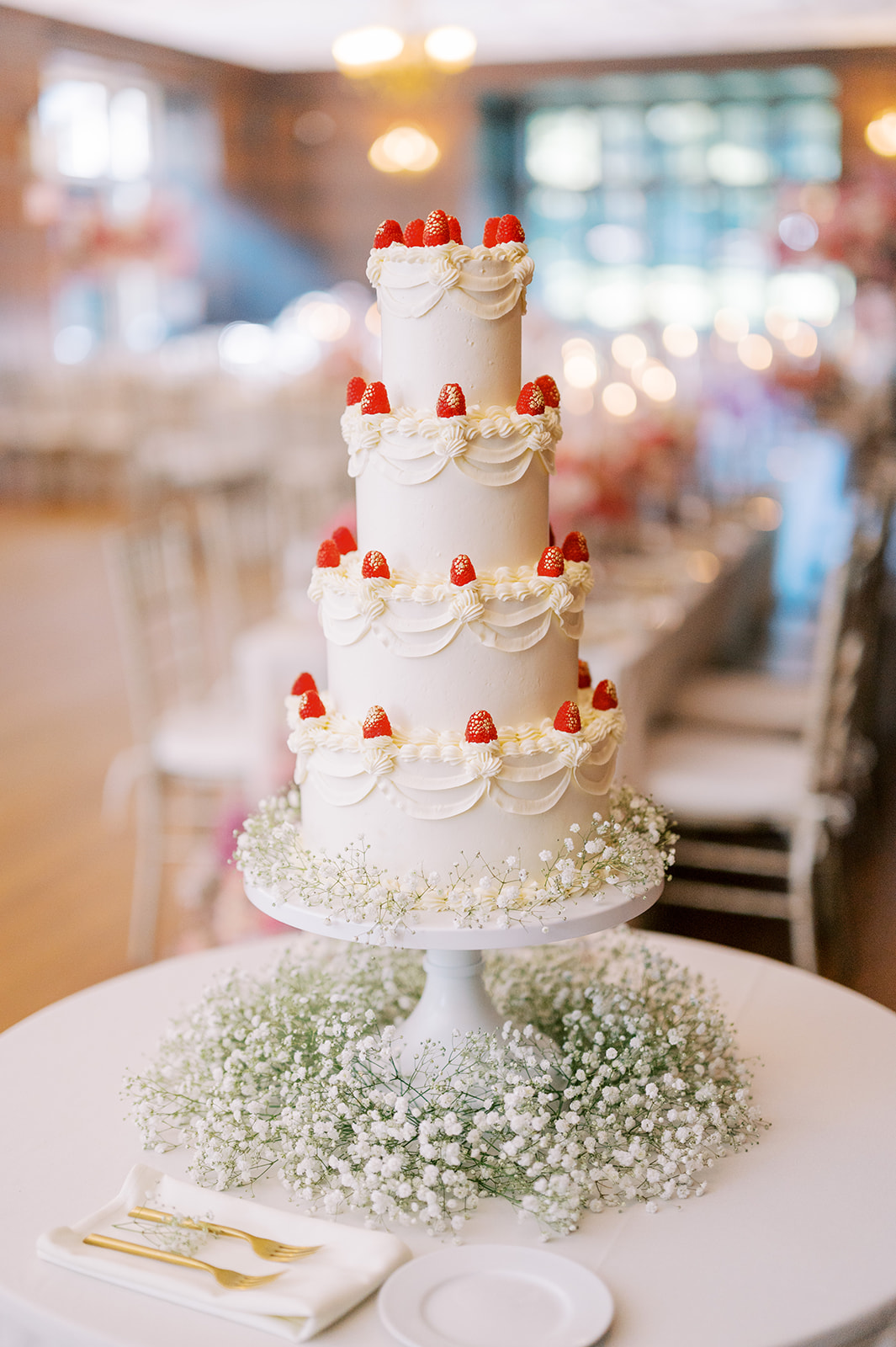 traditional white wedding cake topped with cherries for Timeless Summer Wedding at Parque at Historic Hunting Hill Mansi