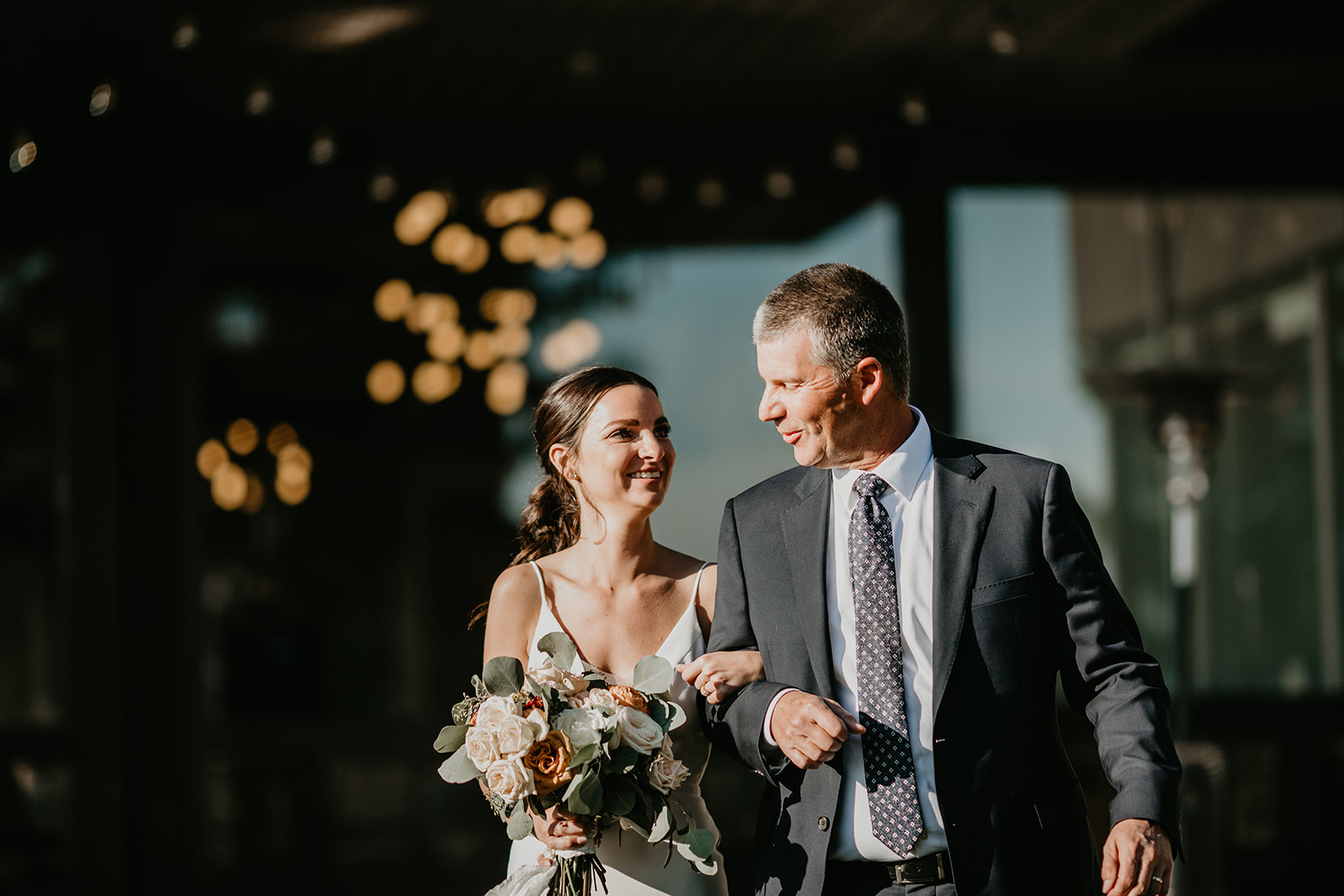 Bride with dad walking down the isle at her Calgary Pinebrook Golf Club wedding