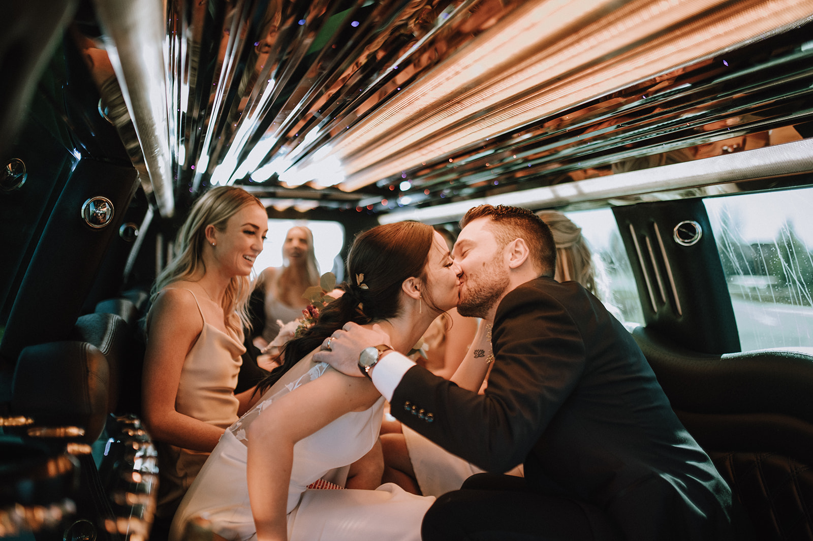 Bride and groom in Limo
