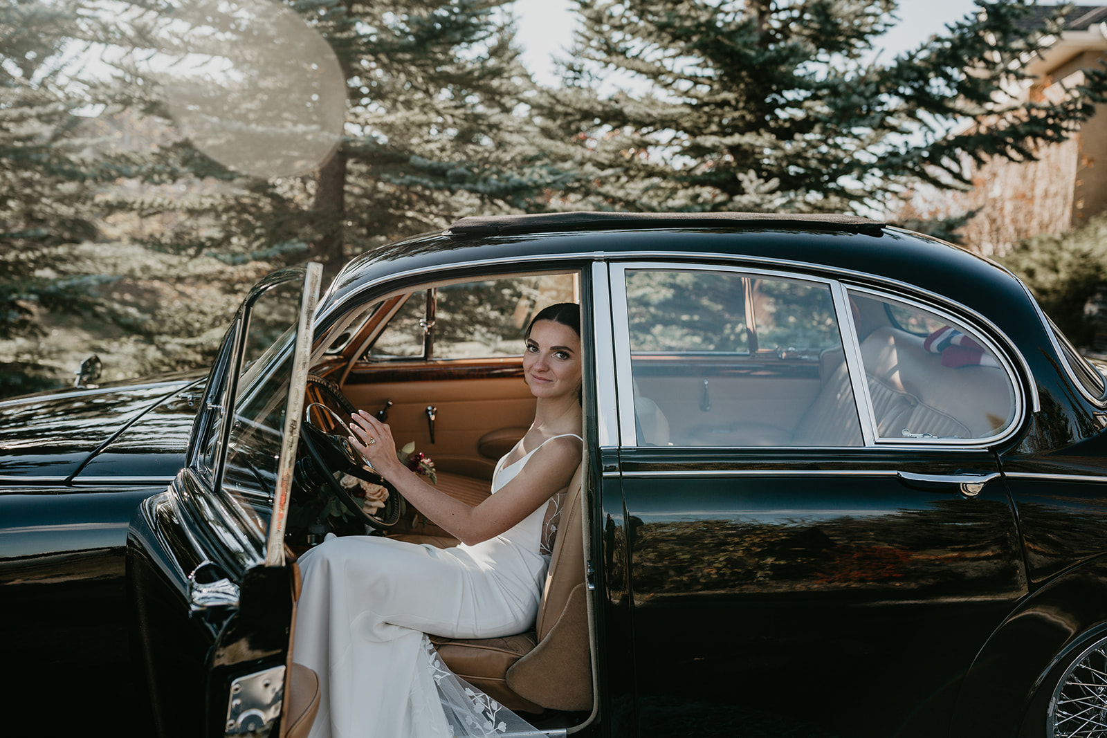 bride in a vintage Jaguar 